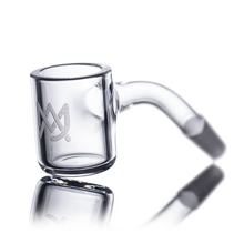 The MJ Arsenal 45 Degree Full Weld Quartz Banger features a clear glass design with a cylindrical bucket, angled neck, and etched logo on the side, shown on a white reflective surface.