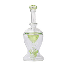 The Human Grade The Nuke Glass Rig is a clear borosilicate dab rig with an inner green accent, rounded base, curved chamber, vertical mouthpiece, and a mushroom cloud perc for smooth hits.