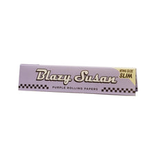 A pack of Blazy Susan Purple Rolling Papers, king size slim with a checkered design and vibrant purple color, shown on a white background.