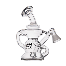 The MJ Arsenal Hydra Vape Edition is a clear glass mini dab rig with an intricate design, slanted mouthpiece, curved side handles, and a black logo on the chamber, shown against a plain white background.