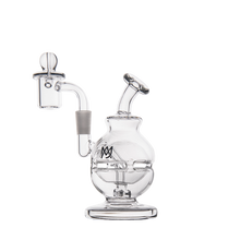 The MJ Arsenal Royale Mini Dab Rig is a clear borosilicate glass water pipe with a round base, angled mouthpiece, side chamber, fab egg percolator, and MX logo on the body, shown against a white background.
