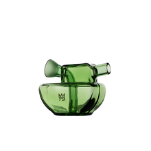 The MJ Arsenal Commander Blunt Bubbler is a modern, sculptural green borosilicate glass piece with curved and angular forms, a spout-like protrusion, and a hollow opening, set against a plain white background.