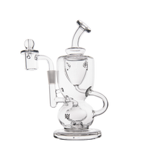 The MJ Arsenal Titan Mini Dab Rig, made from borosilicate glass, features curved tubes, a round base, side bowl, and top mouthpiece. Shown in clear glass against a plain white background.