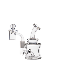 The MJ Arsenal Jammer Mini Dab Rig is a clear borosilicate glass water pipe with a short, wide base, angled mouthpiece, and detachable handled bowl. A small crown logo on the front adds style to this portable dab rig.