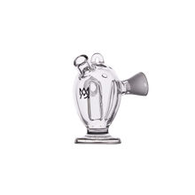 The MJ Arsenal Dubbler Original Double Bubbler is a clear borosilicate glass piece with a spout and short handle, resembling a small pitcher, designed for water filtration and shown on a plain white background.