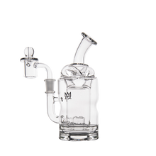 The MJ Arsenal Turbine Mini Dab Rig is a clear borosilicate glass piece with a bent mouthpiece, side chamber, domed top, and small M logo on the body, displayed on a white background.