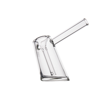 The MJ Arsenal Fulcrum Bubbler, made from durable borosilicate glass with a tilted cylindrical base and angled mouthpiece, is shown in clear glass on a plain white background.