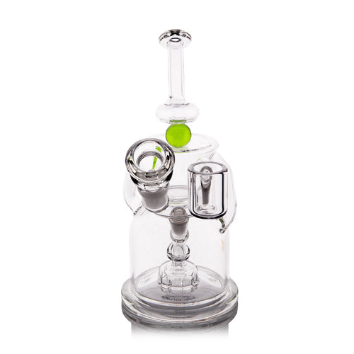 The MJ Arsenal The iLL-ien Dab Rig is a clear glass water pipe with a cylindrical base, side bowl, green accent, intricate internal chambers, and a straight neck mouthpiece.