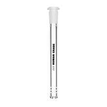 The Human Grade Downstems feature clear glass with a white stopper, serve as 10mm downstem or water pipe replacements, and display "HUMAN GRADE" printed vertically in black plus measurement markings near the bottom.