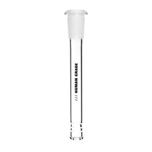 The Human Grade Downstems are clear glass with a frosted stopper, ideal as a 14mm water pipe or downstem replacement. “HUMAN GRADE” is printed vertically in black, with two horizontal ridges at the bottom on a white background.