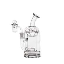 The MJ Arsenal Turbine Mini Dab Rig is a clear borosilicate glass water pipe featuring a curved mouthpiece, round chamber, and joint with a glass stopper, shown on a white background.