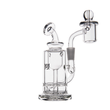 The MJ Arsenal Ursa Mini Dab Rig, made of clear borosilicate glass with a cylindrical base, bent neck, attached bowl, and dome-shaped carb cap, is displayed against a white background.