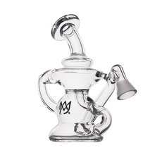 The MJ Arsenal Hydra Vape Edition is a clear glass mini dab rig with a curvy design, wide base, angled mouthpiece, side splash-resistant bubbler, and black logo near the base. Shown on a white background.