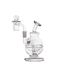 The MJ Arsenal Royale Mini Dab Rig is a clear borosilicate glass water pipe featuring a round base, angled mouthpiece, and attached bowl, shown against a plain white background.