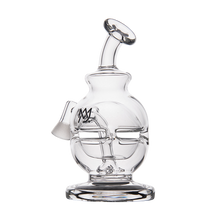 The MJ Arsenal Royale Vape Edition is a clear glass water pipe with a stylized human face design, round base, angled mouthpiece, and artistic head details—ideal as a unique dab rig or paired with your favorite vaporizer pen.