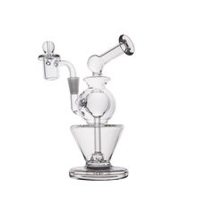 The MJ Arsenal Gemini Mini Dab Rig, made of clear borosilicate glass, features a spherical chamber, angled mouthpiece, and attached bowl. Portable and durable, it's ideal for stylish on-the-go sessions against any backdrop.