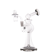 The MJ Arsenal Apollo Mini Dab Rig features clear borosilicate glass, a wide base, curved neck, angled mouthpiece, round chamber, side attachment, and dome-shaped bowl for optimal flavor preservation against a plain white background.