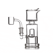 The MJ Arsenal Column Mini Dab Rig, made of clear borosilicate glass with a cylindrical chamber, side mouthpiece, and vertical percolator for smoking or vaporizing substances, is shown on a white background.