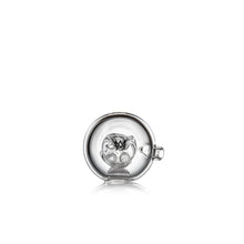 The MJ Arsenal Tetra is a round, clear glass pipe with a small side opening and an intricate interior design, photographed against a white background.