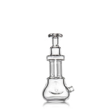 The MJ Arsenal Tetra is a clear borosilicate glass hand pipe featuring a rounded base, cylindrical neck, and angled side opening, photographed against a white background.