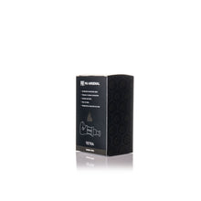 A black rectangular box labeled MJ Arsenal Tetra stands on a white background, showcasing the modern hand pipe crafted from durable borosilicate glass with subtle circular patterns along its side.