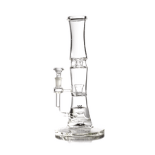 The MJ Arsenal Spire Glass Water Pipe features clear borosilicate glass, a wide round base, cylindrical body, and a side 14mm flower bowl attachment for smooth smoking.