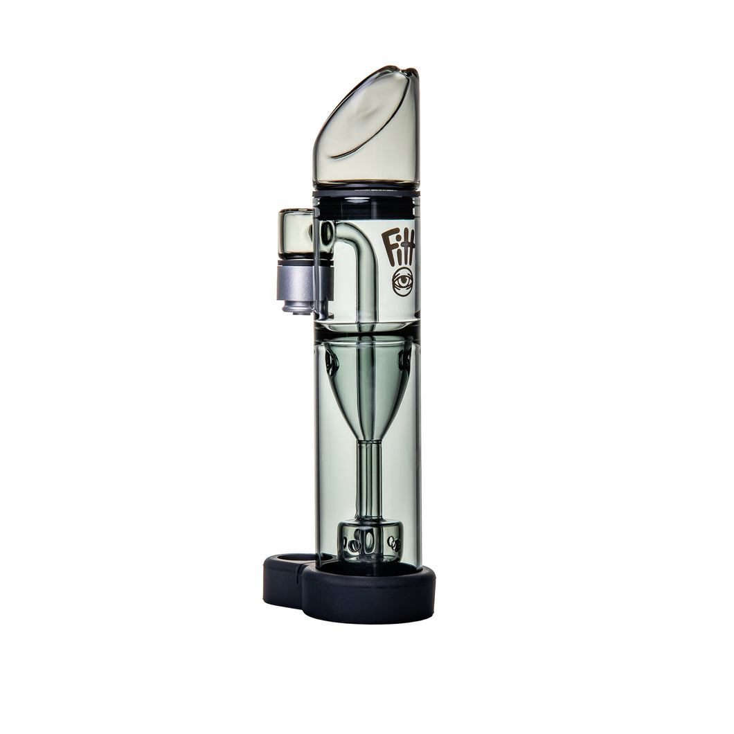 The Ryan Fitt Pillar Pivot Bubbler, a transparent cylindrical glass e-rig attachment featuring a mouthpiece, removable chamber, and black base, is displayed standing upright against a white background.