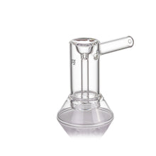 The MJ Arsenal Cove Glass Bubbler, made from clear borosilicate glass, features a cylindrical chamber, straight side handle, and angled base. It is shown on a white background.