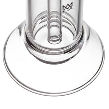 Close-up of the MJ Arsenal Cove Glass Bubbler’s clear glass base and inner tube, emphasizing its circular, transparent structure and sleek design on a white background.