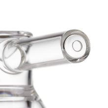 Close-up of the MJ Arsenal Grotto Glass Pipe crafted from clear borosilicate glass, shown extending horizontally with a circular opening and smooth surfaces, photographed against a white background.