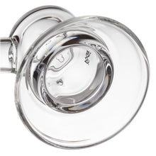 A close-up view of the MJ Arsenal Grotto Glass Pipe, made from clear borosilicate glass, seen from above with reflections and light distortions highlighting its smooth surface.