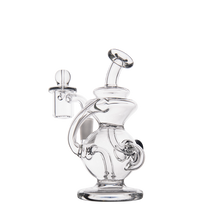 The MJ Arsenal Mini Jig Mini Dab Rig is a clear glass water pipe with a curved neck, round base, and attached glass bowl, displayed on a plain white background.