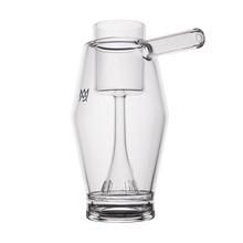 The MJ Arsenal Proxy Bubbler is a sleek, clear borosilicate glass piece with a side spout and built-in strainer at the base, resembling a modern dabbing accessory, shown against a plain white background.