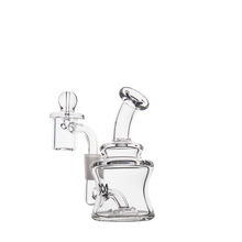 The MJ Arsenal Jammer Mini Dab Rig is a clear borosilicate glass rig featuring a cylindrical chamber, angled mouthpiece, and quartz banger with carb cap, shown compactly against a plain white background.