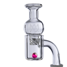 Close-up of MJ Arsenal Ruby Terp Pearls (6mm), essential accessories for vaporizing concentrates, shown in a clear glass banger with a spiral insert and pink marble, set against a white background.