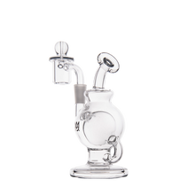 The MJ Arsenal Atlas Mini Dab Rig, made of clear borosilicate glass with a round base, curved neck, and attached dome and nail for vaporizing concentrates, is shown on a white background.