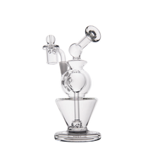 The MJ Arsenal Gemini Mini Dab Rig is a clear borosilicate glass rig with a round chamber, angled mouthpiece, and bowl piece. It stands upright on a flat base—ideal as a portable dab rig for any setup.