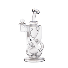 The MJ Arsenal Titan Mini Dab Rig is made of clear borosilicate glass with intricate curves, a round base, side chamber, incycler design, removable bowl, and a top-mounted mouthpiece for smooth vaporizing.