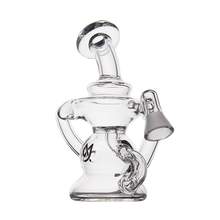 The MJ Arsenal Hydra Vape Edition is a clear glass water pipe with a unique, artistic design featuring a wide base, angled neck, spill-resistant bubbler, and a small black logo for a modern sculptural look.