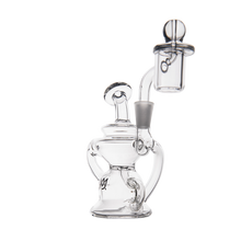 The MJ Arsenal Hydra Mini Dab Rig features clear glass with intricate curves and a cylindrical attachment, displayed against a plain white background.