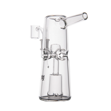 The MJ Arsenal Turret Mini Dab Rig is a clear borosilicate glass piece with intricate internal chambers and a side mouthpiece, shown upright against a plain white background.