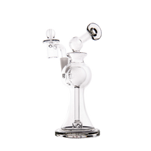 The MJ Arsenal Apollo Mini Dab Rig, made of clear borosilicate glass with a wide base, cylindrical neck, angled mouthpiece, side chamber, and removable attachment, is photographed on a plain white background for optimal flavor preservation.