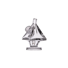 The MJ Arsenal King Bubbler features clear borosilicate glass shaped like a sailboat, with a small round base and pointed sail, resembling a sleek blunt bubbler, displayed against a plain white background.
