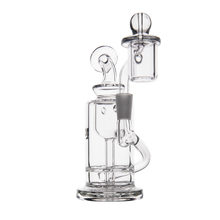 The MJ Arsenal Ursa Mini Dab Rig, made of clear borosilicate glass with a cylindrical chamber, side tube, flat base, and detachable carb cap on top, is photographed against a white background.