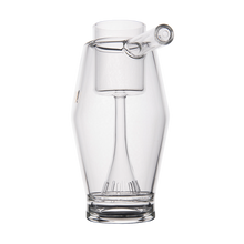 The MJ Arsenal Proxy Bubbler is a sleek borosilicate glass accessory with modern lines, designed for dabbing setups. It comes with a matching glass stir stick and makes a stylish addition to any collection.
