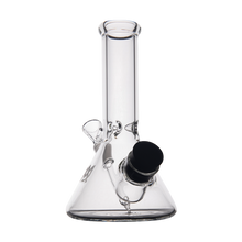 The MJ Arsenal Cache Bong is a clear borosilicate glass beaker bong with a wide base, straight neck, and an angled black bowl near the base, shown on a white background.