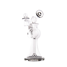 The MJ Arsenal Apollo Mini Dab Rig features clear borosilicate glass, a rounded base, narrow neck, angled mouthpiece, and removable glass bowl for flavor preservation—all set against a plain white background.
