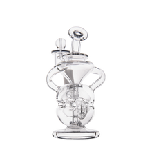 The MJ Arsenal Infinity Mini Dab Rig is a clear, intricately designed borosilicate glass water pipe with circular and curved sections, a central chamber, and multiple handles—ideal for stylish sessions. Set against a plain white background.
