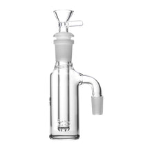 The Human Grade Tube Ash Catcher is a clear glass attachment for water pipes, featuring a cylindrical chamber, vertical slit-diffused downstem, and dual 14mm ground glass joints for secure connection.