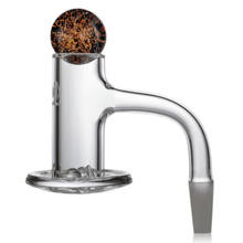 A clear glass attachment with a curved neck and flat, round base, topped with a brown-and-gold patterned marble—compatible with MJ Arsenal Mini Rigs or paired perfectly with the MJ Arsenal Full Weld Quartz Terp Blender for enhanced flavor.